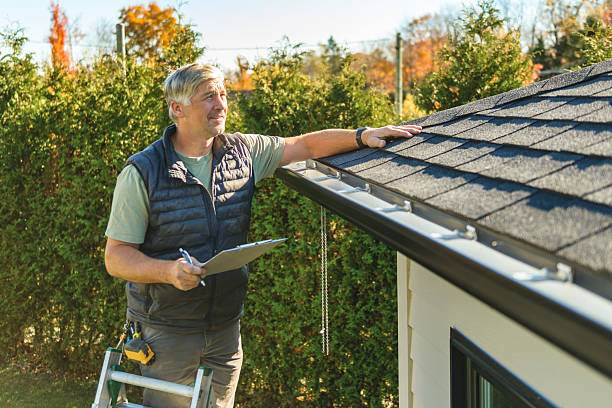 Professional Hail Damage Roof Repair technician working in Dibble, OK